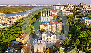 Aerial drone view of Saint Andrew`s church and Andreevska street from above, cityscape of Podol district, skyline of city of Kyiv
