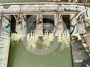 Aerial drone view, small dam over Olt river at springtime