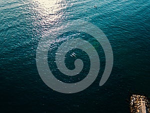 Aerial drone view of the small fisher boat at the ocean in Bali, Indonesia.