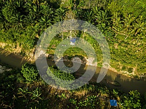 Aerial drone view of a small river at farmland in Jasin, Melaka, Malaysia