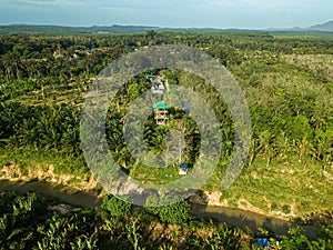 Aerial drone view of a small river at farmland in Jasin, Melaka, Malaysia