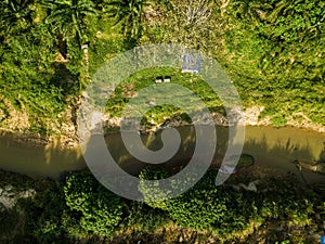 Aerial drone view of a small river at farmland in Jasin, Melaka, Malaysia