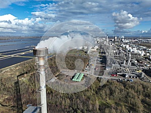 Aerial drone view on smoke stack at the petroleum and chemical industrial park of Moerdijk, The Netherlands.