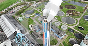 Aerial drone view on the smoke stack of a waste incineration plant. Smoke coming out of industrial waste processing