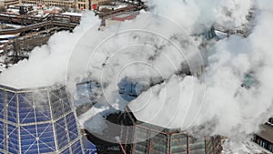 Aerial drone view of smoking pipes and cooling towers of coal thermal power plant. Thermal power station exhaust steam