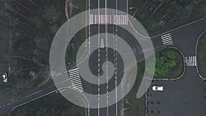 Aerial drone view of speed highway. Top view of crossroads with cars. Car road from bird`s eye view