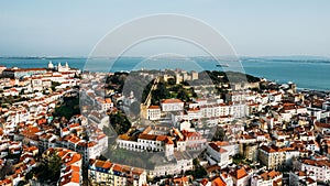 Aerial drone view of St. George Castle in Lisbon, Portugal with surrounding cityscape