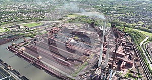 Aerial drone view of a steel and metal production facility in Duisburg, Germany.