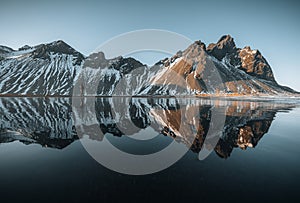 Aerial drone view of sunset runrise and gorgeous reflection of Vestrahorn mountain on Stokksnes cape in Iceland