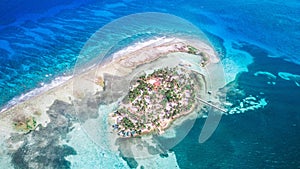 Aerial drone view of Tobacco Caye small Caribbean island in Belize Barrier Reef
