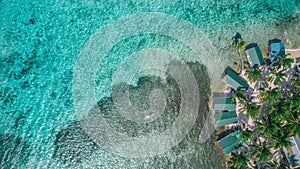 Aerial drone view of Tobacco Caye small Caribbean island in Belize Barrier Reef