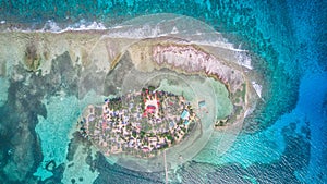 Aerial drone view of Tobacco Caye small Caribbean island in Belize Barrier Reef photo