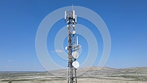 Aerial drone view of tower antennas telecommunication cell phone