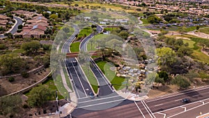 Aerial drone view of traffic on the roads near the Trilogy Golf Club