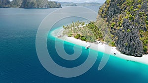 Aerial drone view of tropical Ipil beach, Pinagbuyutan Island, El Nido, Palawan, Philippines. Turquoise blue water