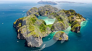 Aerial drone view of tropical Ko Phi Phi island, beaches and boats in blue clear Andaman sea water from above