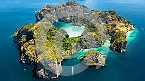 Aerial drone view of tropical Ko Phi Phi island, beaches and boats in blue clear Andaman sea water from above, Thailand