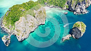 Aerial drone view of tropical Ko Phi Phi island, beaches and boats in blue clear Andaman sea water from above, Thailand