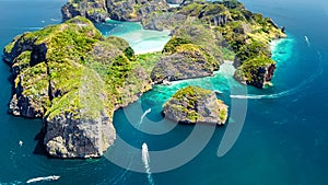 Aerial drone view of tropical Ko Phi Phi island, beaches and boats in blue clear Andaman sea water from above, Thailand