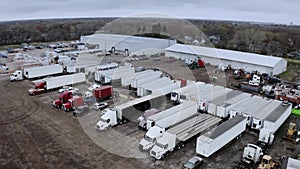 Aerial drone view of Truck repair shop, Service building and many trucks near it