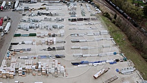 Aerial drone view of Truck repair shop, Service building and many trucks near it. USA