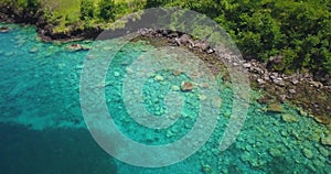 Aerial drone view of two people snorkelling in the tropical waters of the Caribbean sea