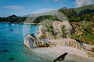 Aerial drone view of unique Anse Source D'Argent tropical beach, La Digue Seychelles. Luxury exotic romantic travel