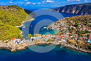 Aerial drone view video of beautiful and picturesque colorful traditional fishing village of Assos in island of Cefalonia, Ionian