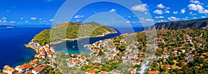 Aerial drone view video of beautiful and picturesque colorful traditional fishing village of Assos in island of Cefalonia, Ionian