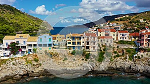 Aerial drone view video of beautiful and picturesque colorful traditional fishing village of Assos in island of Cefalonia, Ionian