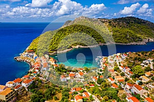 Aerial drone view video of beautiful and picturesque colorful traditional fishing village of Assos in island of Cefalonia, Ionian