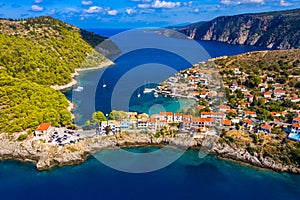 Aerial drone view video of beautiful and picturesque colorful traditional fishing village of Assos in island of Cefalonia, Ionian photo