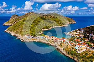 Aerial drone view video of beautiful and picturesque colorful traditional fishing village of Assos in island of Cefalonia, Ionian