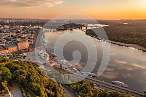 Aerial drone view. View of the Dnieper River and the Podil district in Kiev in the early morning.