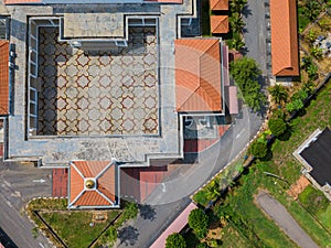 Aerial drone view of a white mosque known as Tun Khalil Mosque at Asahan, Melaka, Malaysia.