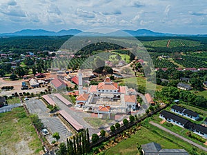 Aerial drone view of a white mosque known as Tun Khalil Mosque at Asahan, Melaka, Malaysia.