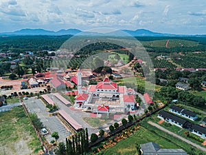 Aerial drone view of a white mosque known as Tun Khalil Mosque at Asahan, Melaka, Malaysia.