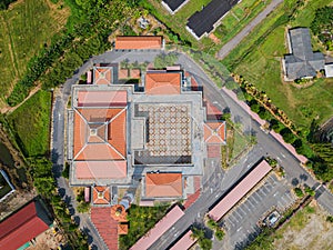 Aerial drone view of a white mosque known as Tun Khalil Mosque at Asahan, Melaka, Malaysia.