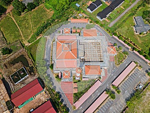 Aerial drone view of a white mosque known as Tun Khalil Mosque at Asahan, Melaka, Malaysia.