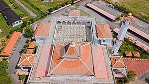 Aerial drone view of a white mosque known as Tun Khalil Mosque at Asahan, Melaka, Malaysia.