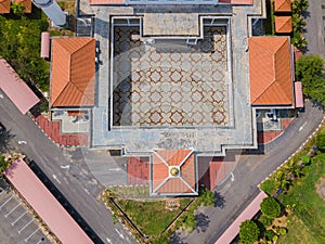 Aerial drone view of a white mosque known as Tun Khalil Mosque at Asahan, Melaka, Malaysia.