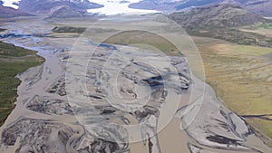 Aerial drone view of wild glacial rivers and moraine deposits. Meandering melt water rivers from Vatnajokull ice cap deposit morai