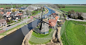 Aerial drone view windmill typical dutch country polder scene.