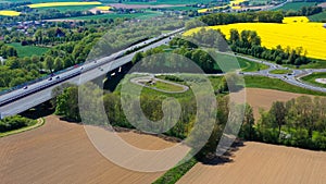 Aerial drone view of yellow rapeseed fields in German countryside