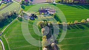 Aerial drone view of yellow rapeseed fields in German countryside