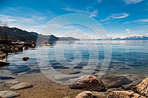 Lake Tahoe amazing sunrise deep blue water and snow capped mountains