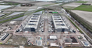 Aerial drone views the construction of a large scale big tech datacenter at Agriport, The Netherlands. Internet cloud