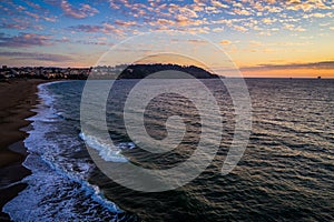 Aerial drone views at sunset over Bay area of San Francisco California at Houses and mansions extending out into the Coast