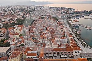 Aerial drone west side view of Diocletian Palace by riva in Split old town in Croatia in sunrise