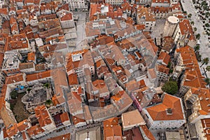 Aerial drone west side view of Diocletian Palace by riva in Split old town in Croatia in sunrise